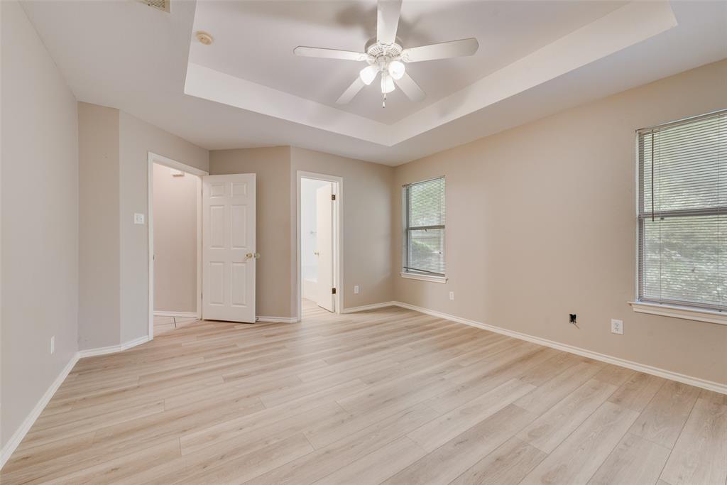 225 Juniper Ridge Court DeSoto, TX 75115 - Photo 12 of 17 wooden floor in an empty room with a window