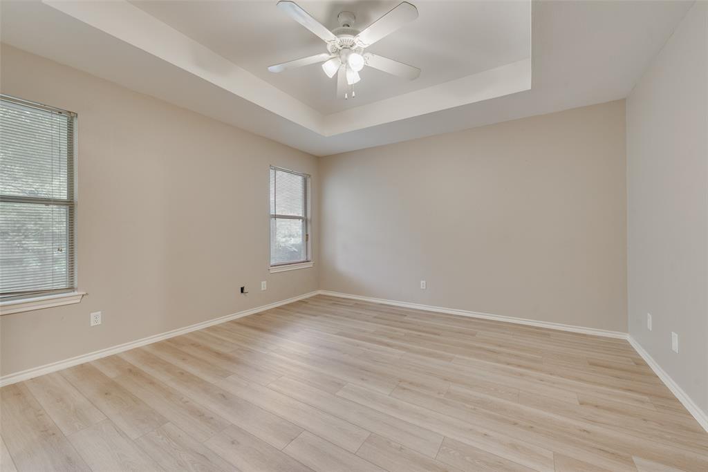 225 Juniper Ridge Court DeSoto, TX 75115 - Photo 14 of 17 wooden floor in an empty room with a window