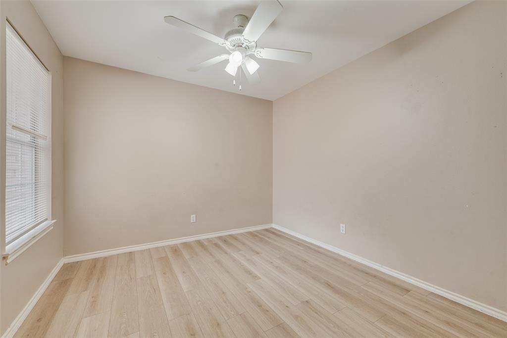 225 Juniper Ridge Court DeSoto, TX 75115 - Photo 15 of 17 wooden floor in an empty room with a window