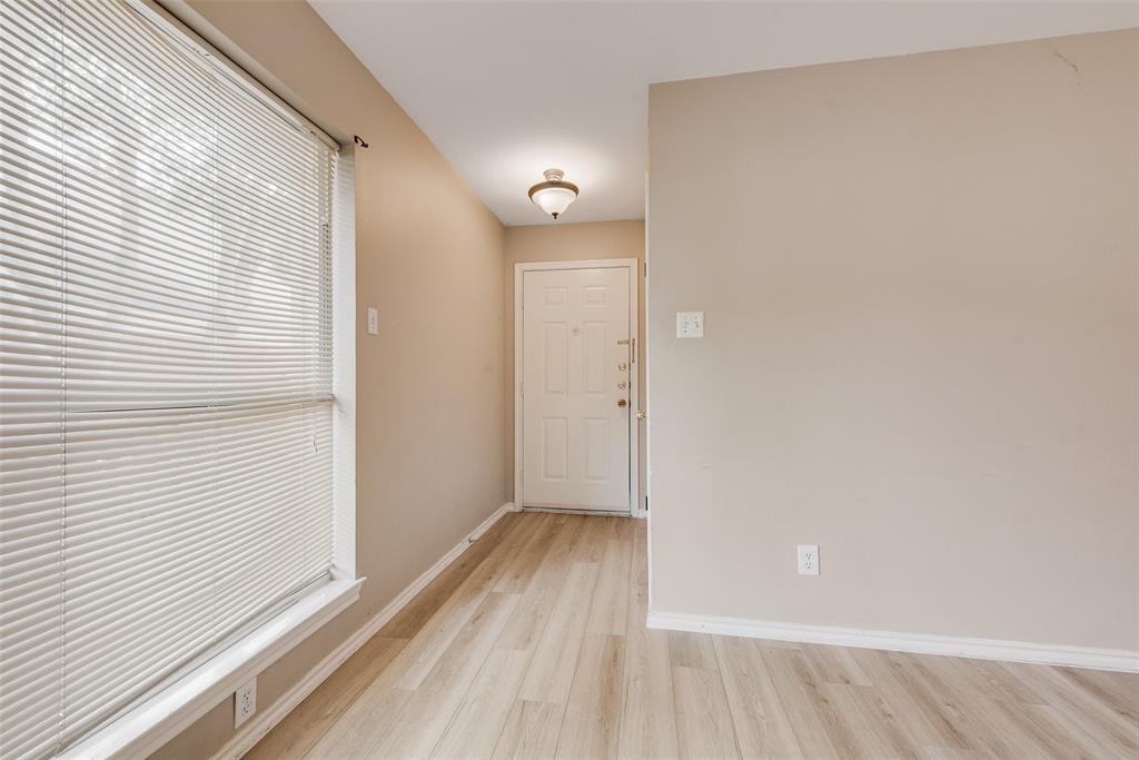 225 Juniper Ridge Court DeSoto, TX 75115 - Photo 3 of 17 a view of a small space with wooden floor and a window