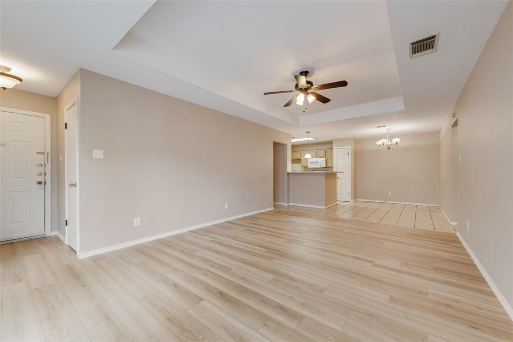225 Juniper Ridge Court DeSoto, TX 75115 - Photo 5 of 17 wooden floor in an empty room with a window