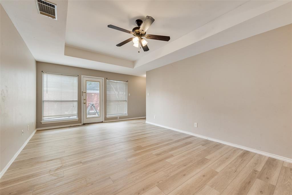 225 Juniper Ridge Court DeSoto, TX 75115 - Photo 6 of 17 a view of empty room with wooden floor and fan