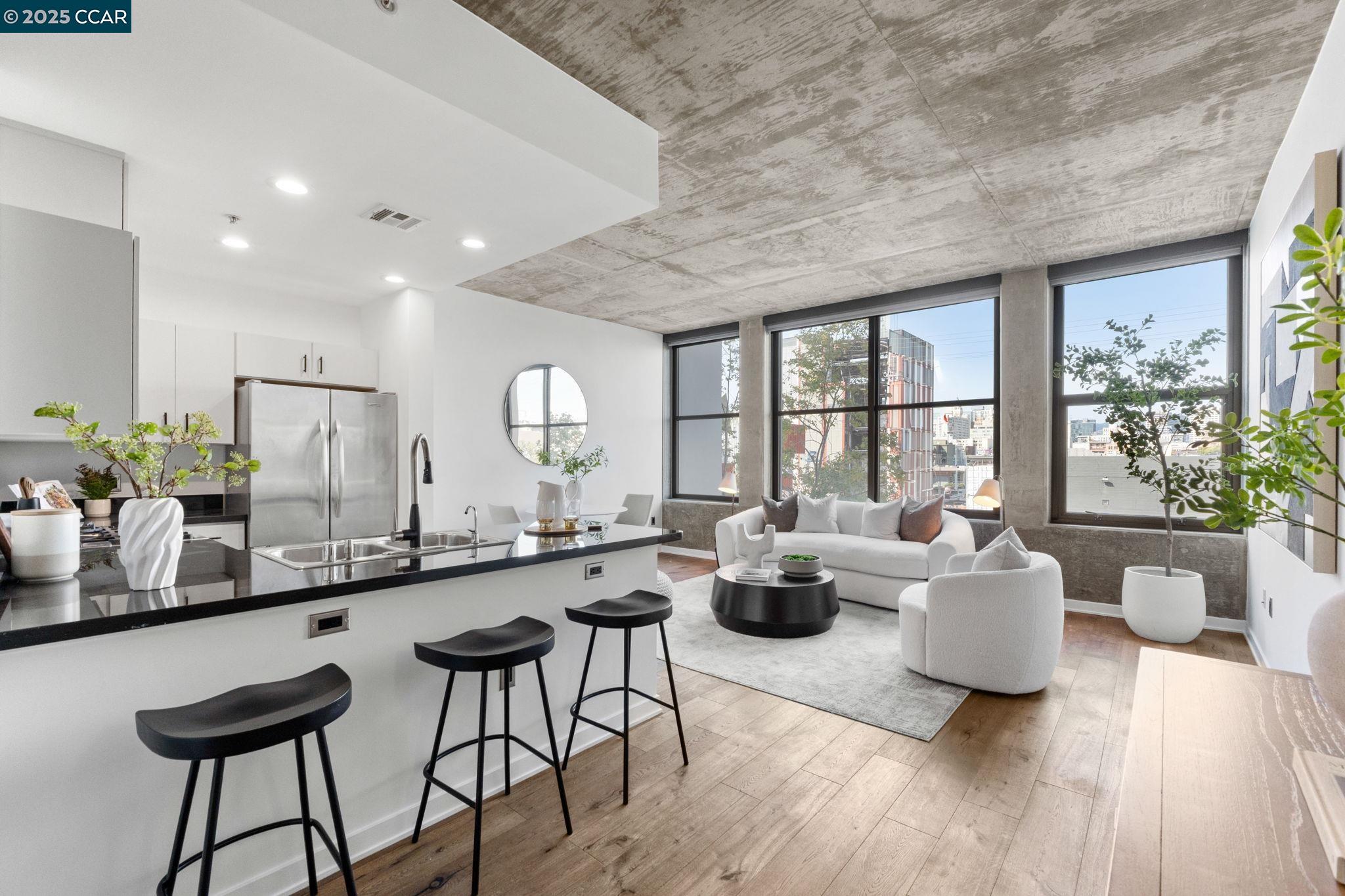 a large living room with a large window and furniture