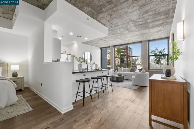 a very nice looking living room with a large window