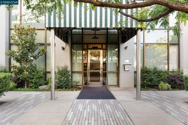 a view of a porch with wooden floor and gate