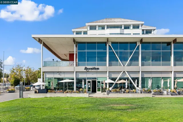 a view of a terrace with lawn chairs and iron
