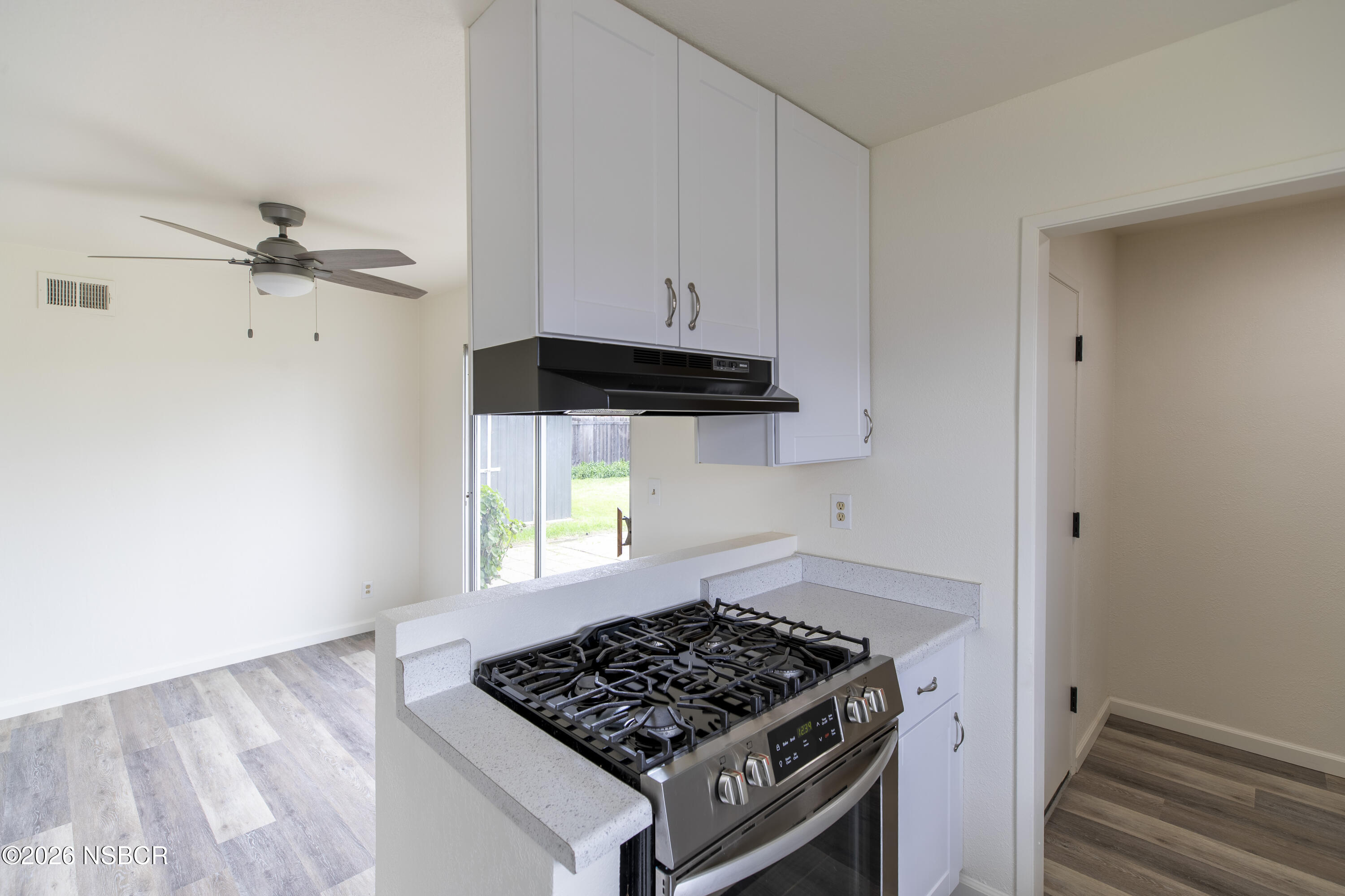 901 Alden Avenue Lompoc, CA 93436 - Photo 14 of 42 a kitchen with a stove and a cabinet