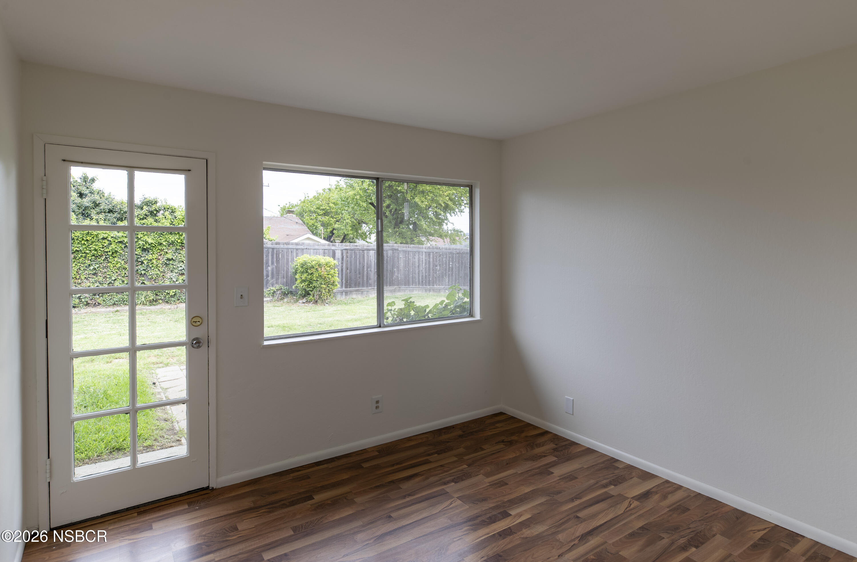 901 Alden Avenue Lompoc, CA 93436 - Photo 18 of 42 a view of an empty room with wooden floor and a window