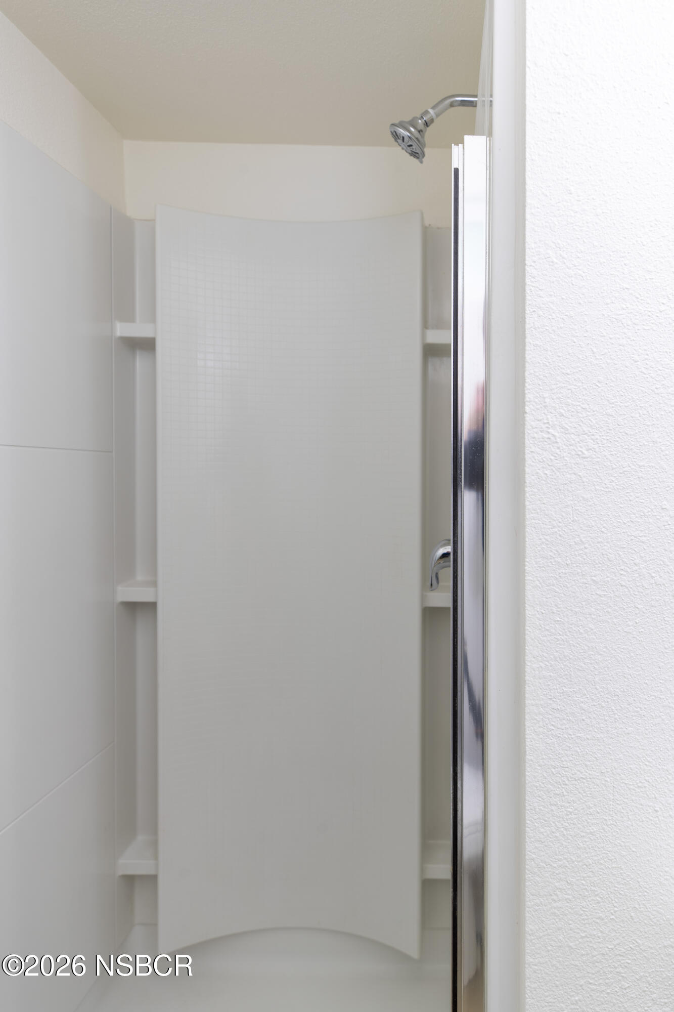 901 Alden Avenue Lompoc, CA 93436 - Photo 24 of 42 a bathroom with a glass shower door