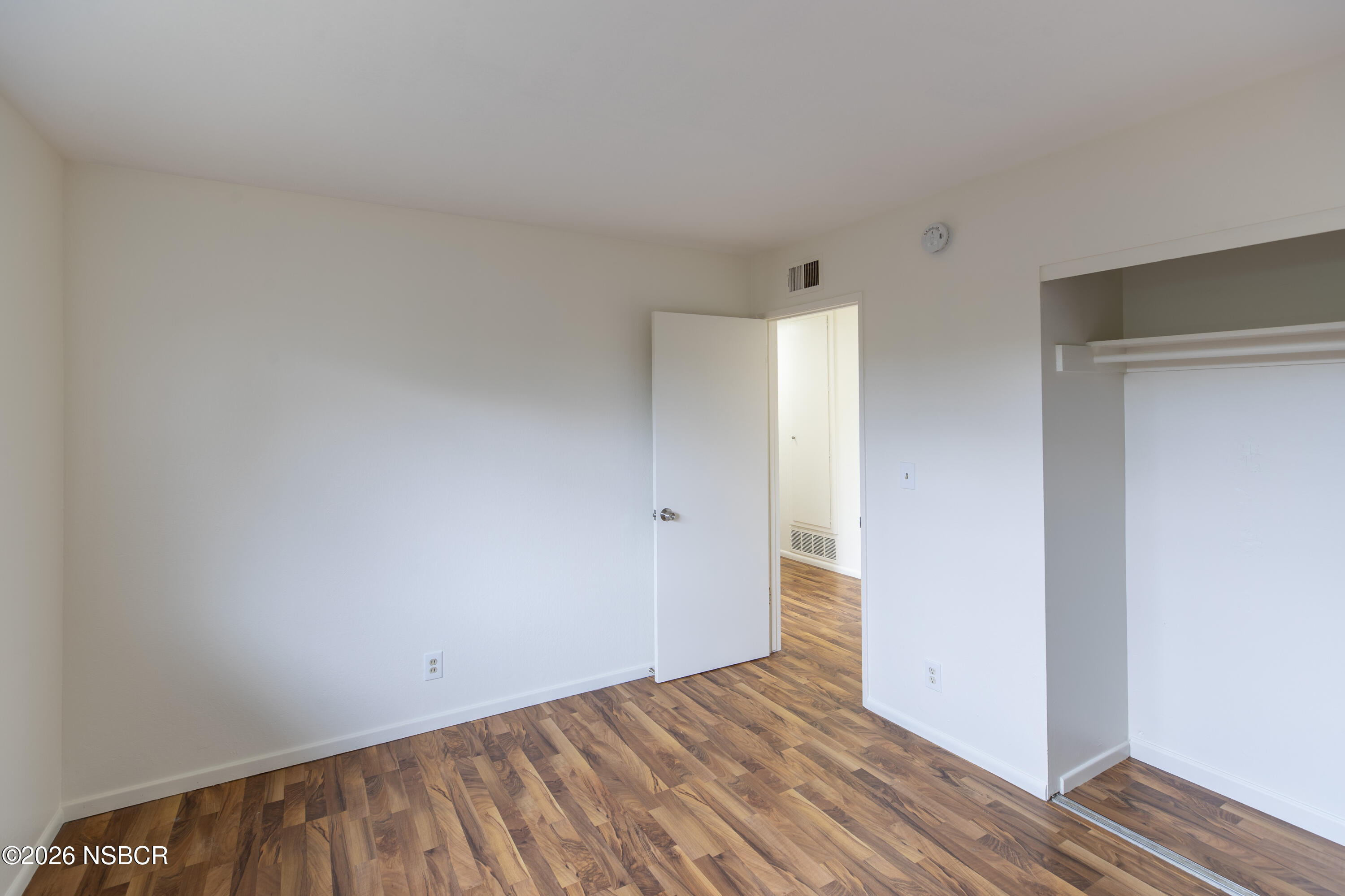 901 Alden Avenue Lompoc, CA 93436 - Photo 28 of 42 a view of an empty room with wooden floor
