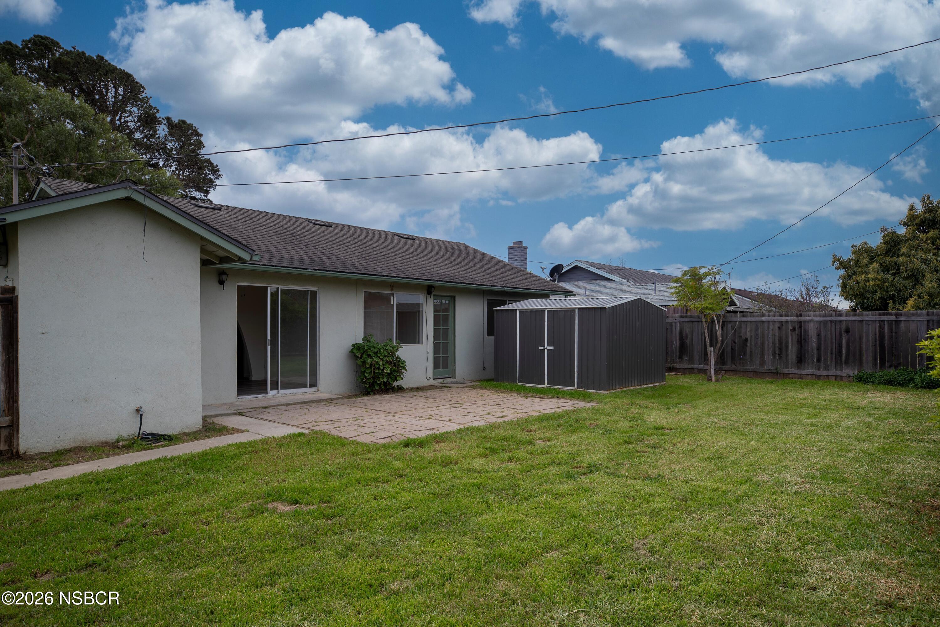 901 Alden Avenue Lompoc, CA 93436 - Photo 35 of 42 a view of a house with a yard and plants