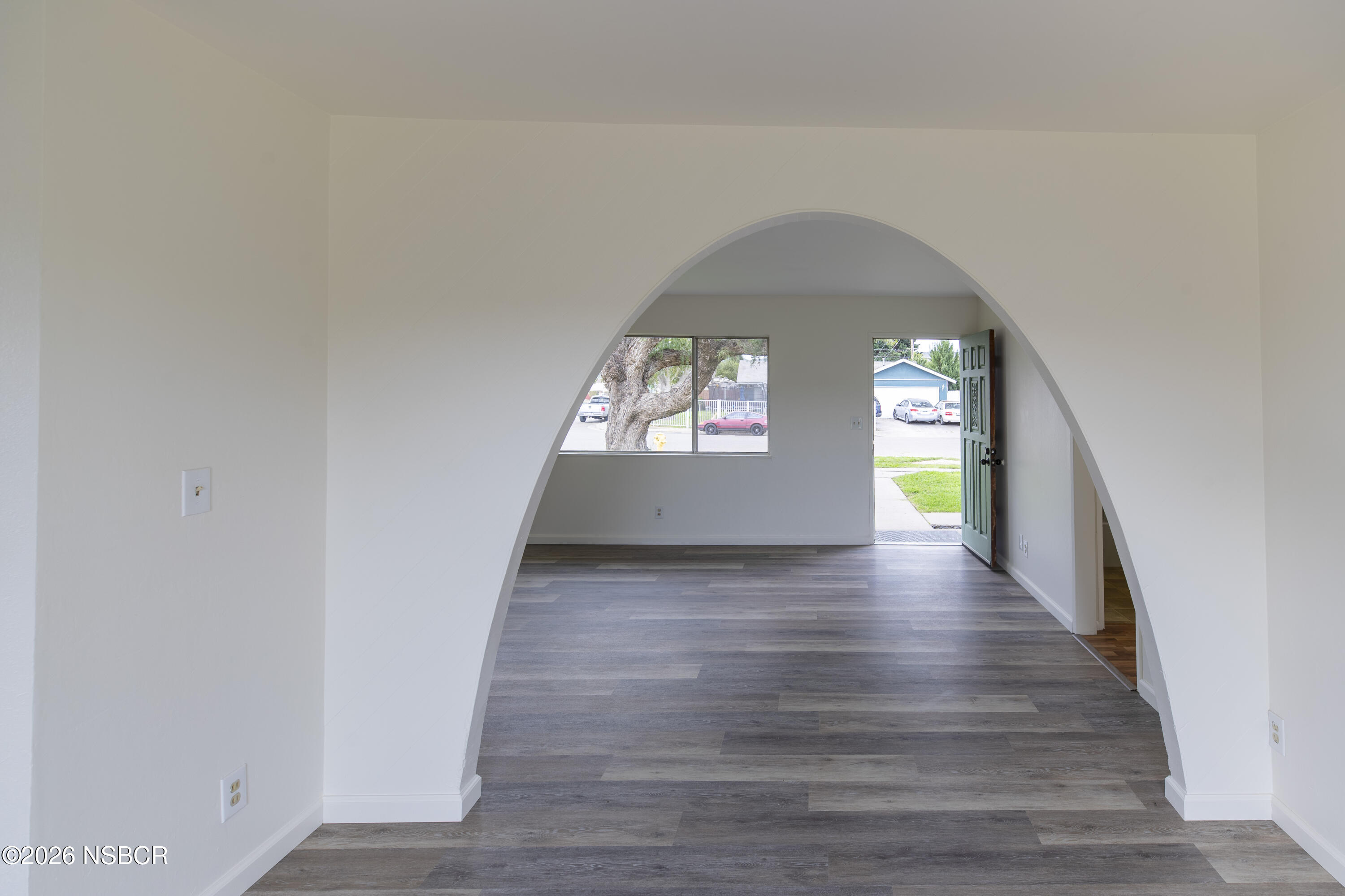 901 Alden Avenue Lompoc, CA 93436 - Photo 7 of 42 a view of hallway with wooden floor and a window