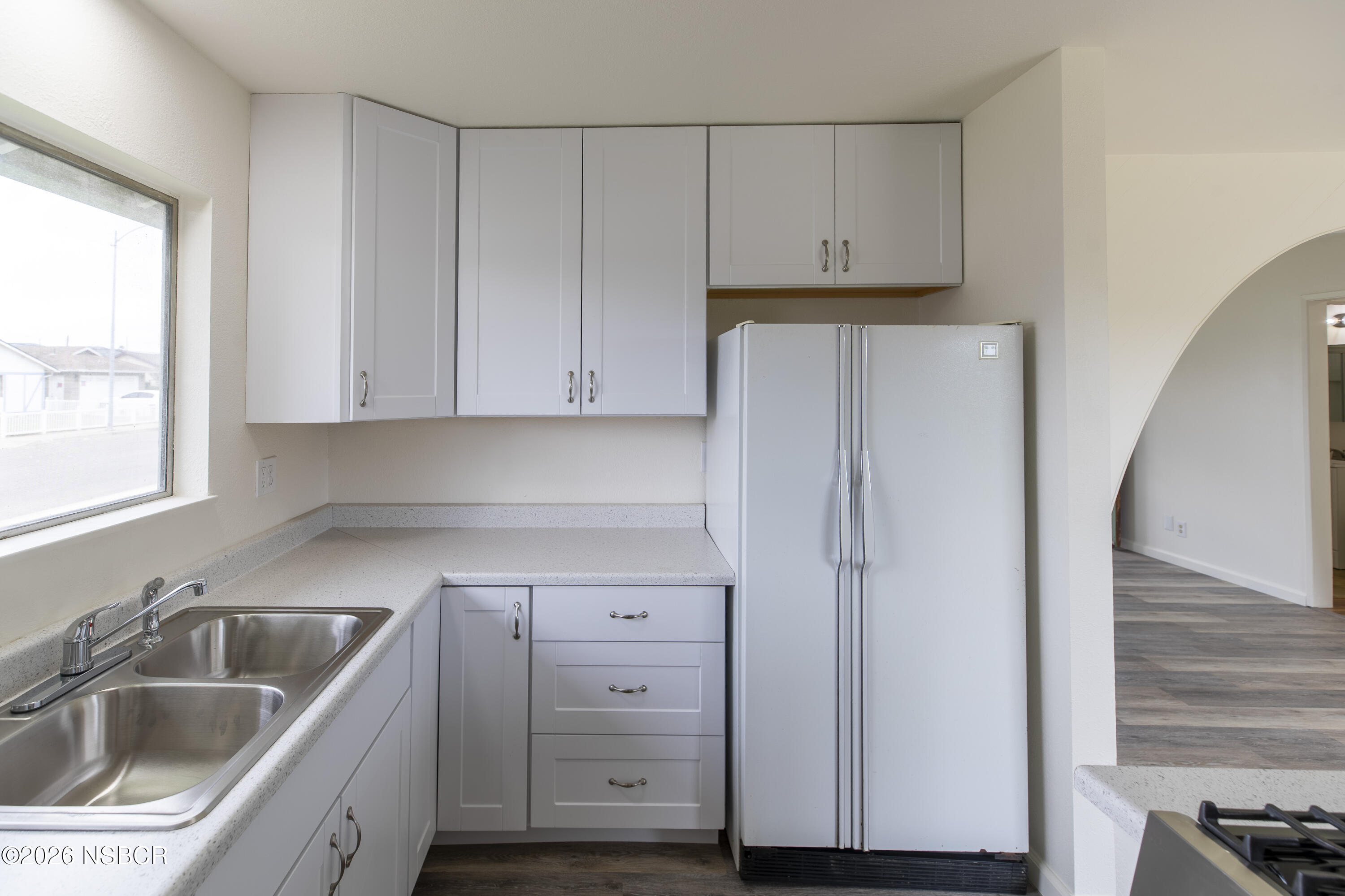 901 Alden Avenue Lompoc, CA 93436 - Photo 9 of 42 a kitchen with refrigerator sink and cabinets
