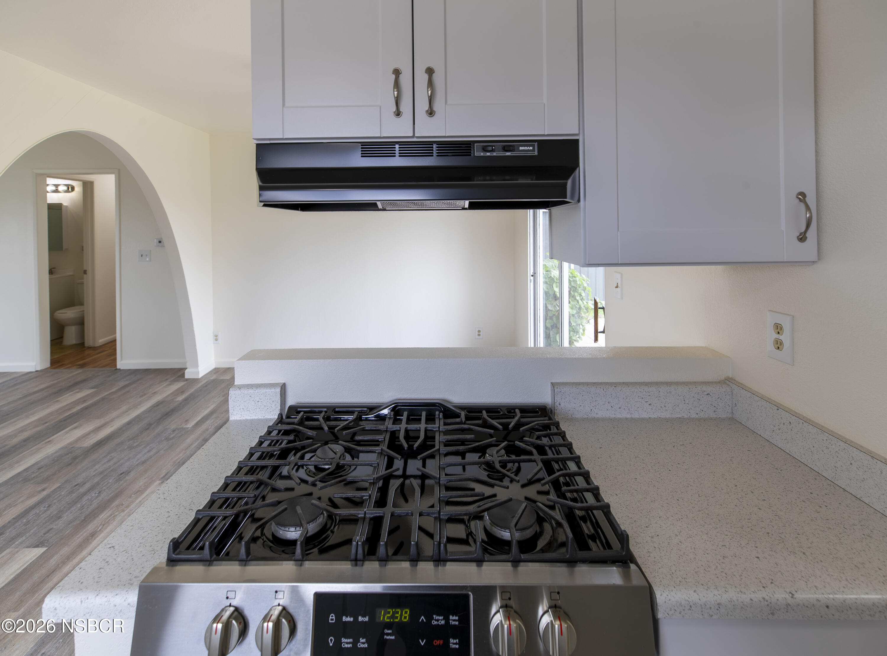 901 Alden Avenue Lompoc, CA 93436 - Photo 10 of 42 a kitchen with a stove and a cabinet