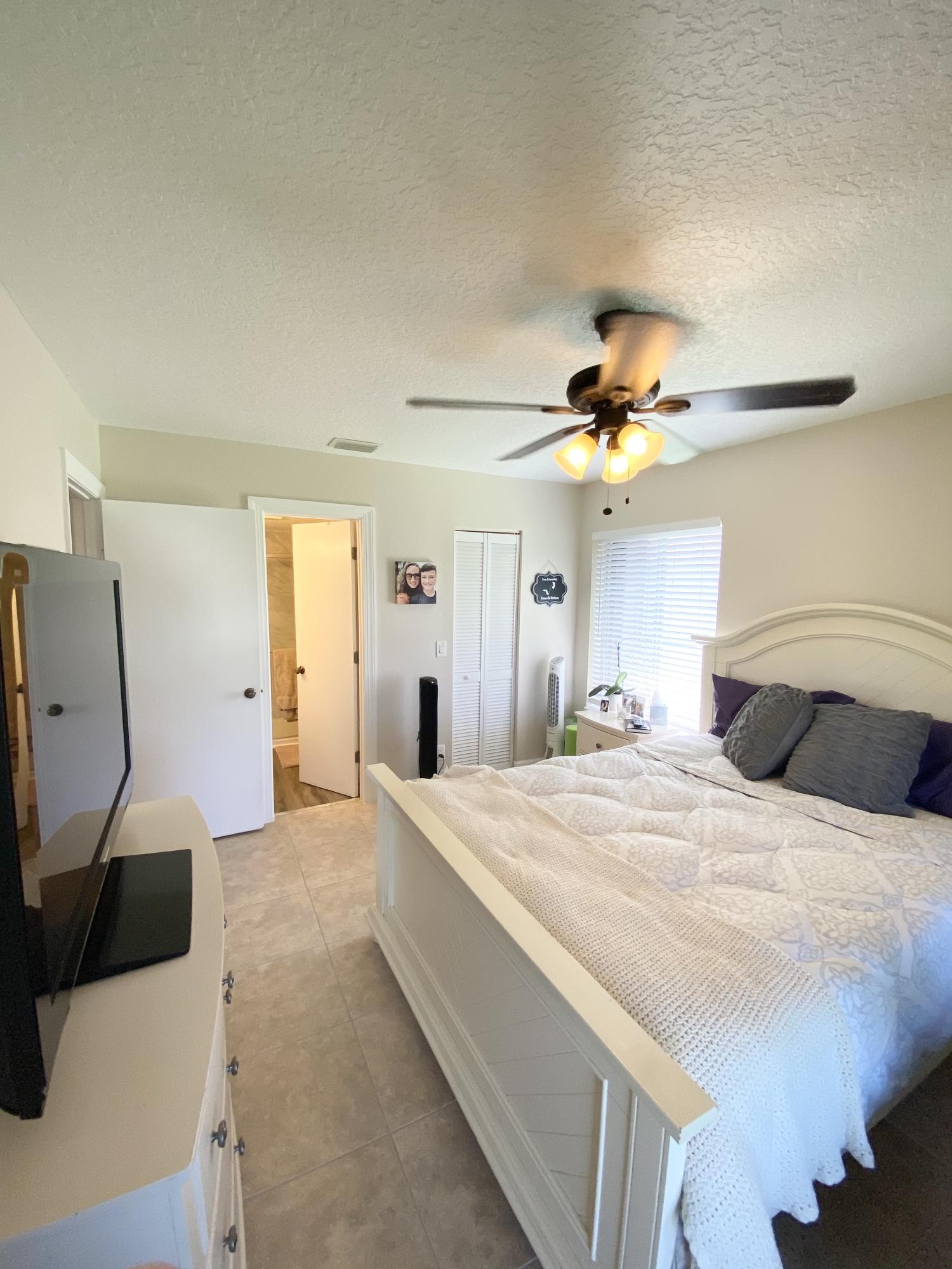 6313 Chasewood Drive, Unit H Jupiter, FL 33458 - Photo 5 of 11 Master Bedroom