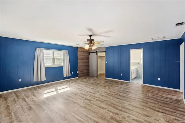 a view of a livingroom with a chandelier fan