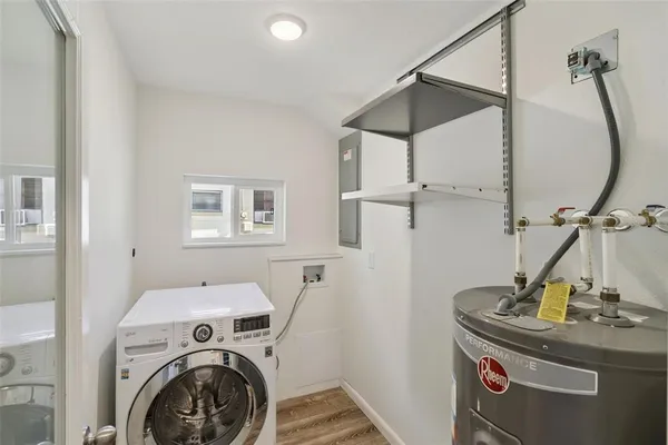 a view of a storage & utility room with a sink
