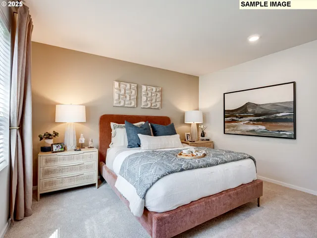 a bedroom with bed and wall painting