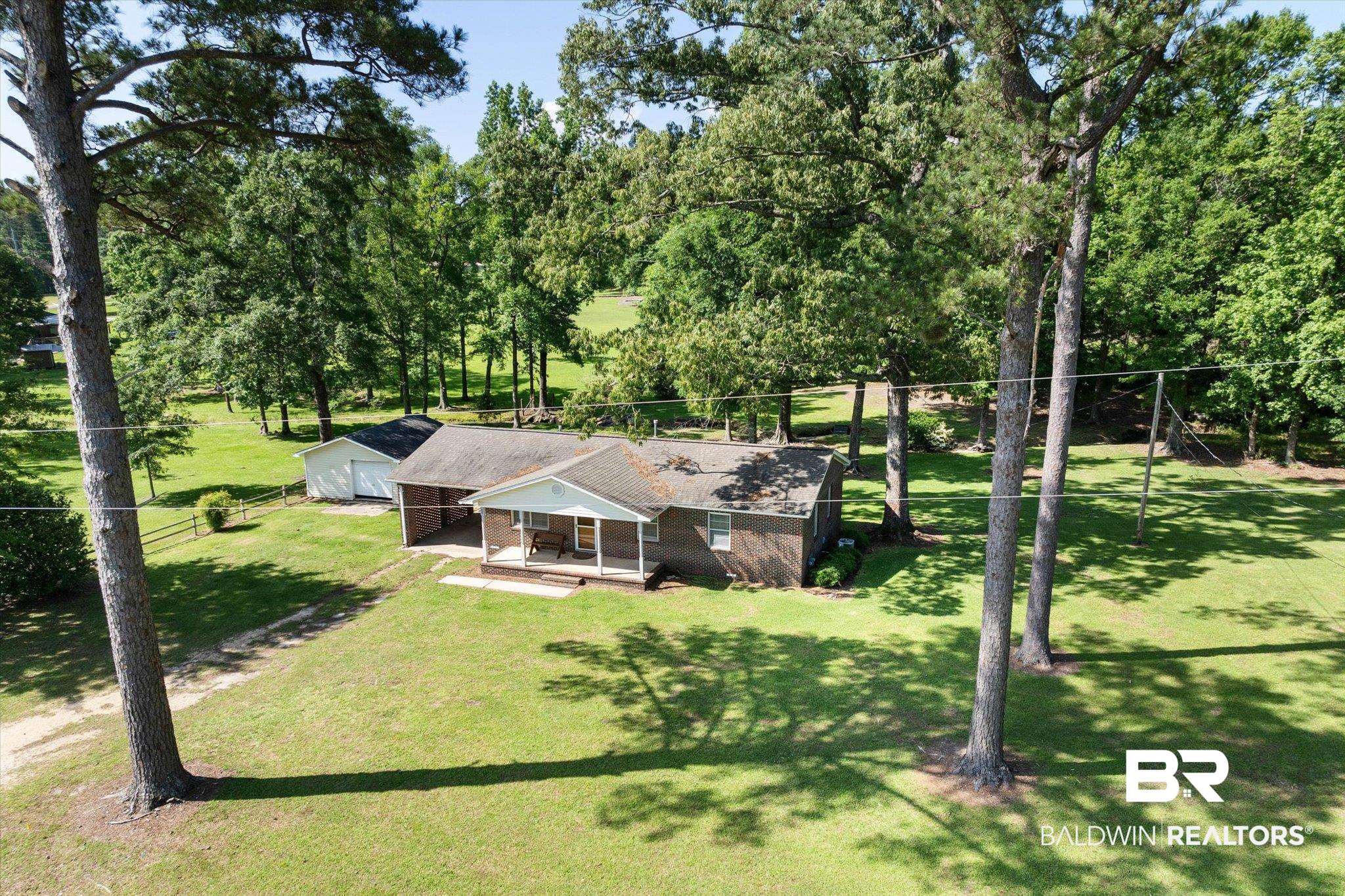 427 Upper Ferry Road Leroy, AL 36548 - Photo 20 of 37 View of subject property featuring a tree filled landscape