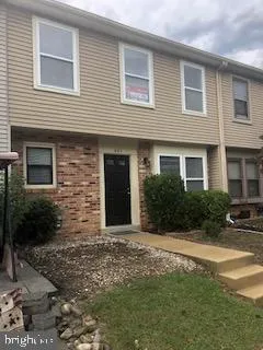 a front view of a house with yard