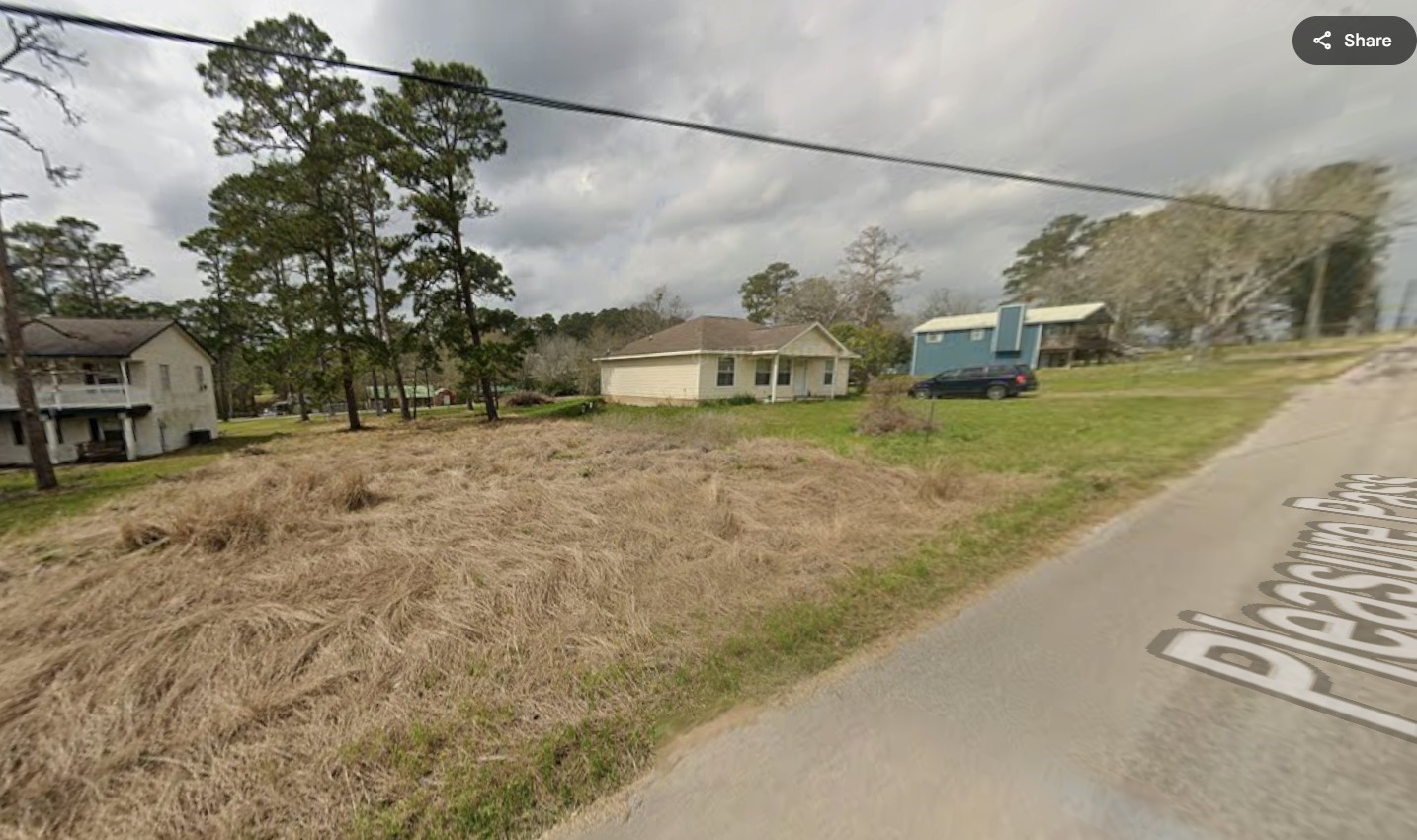 102 Pleasure Pass Coldspring, TX 77331 - Photo 2 of 5 a view of a street with houses