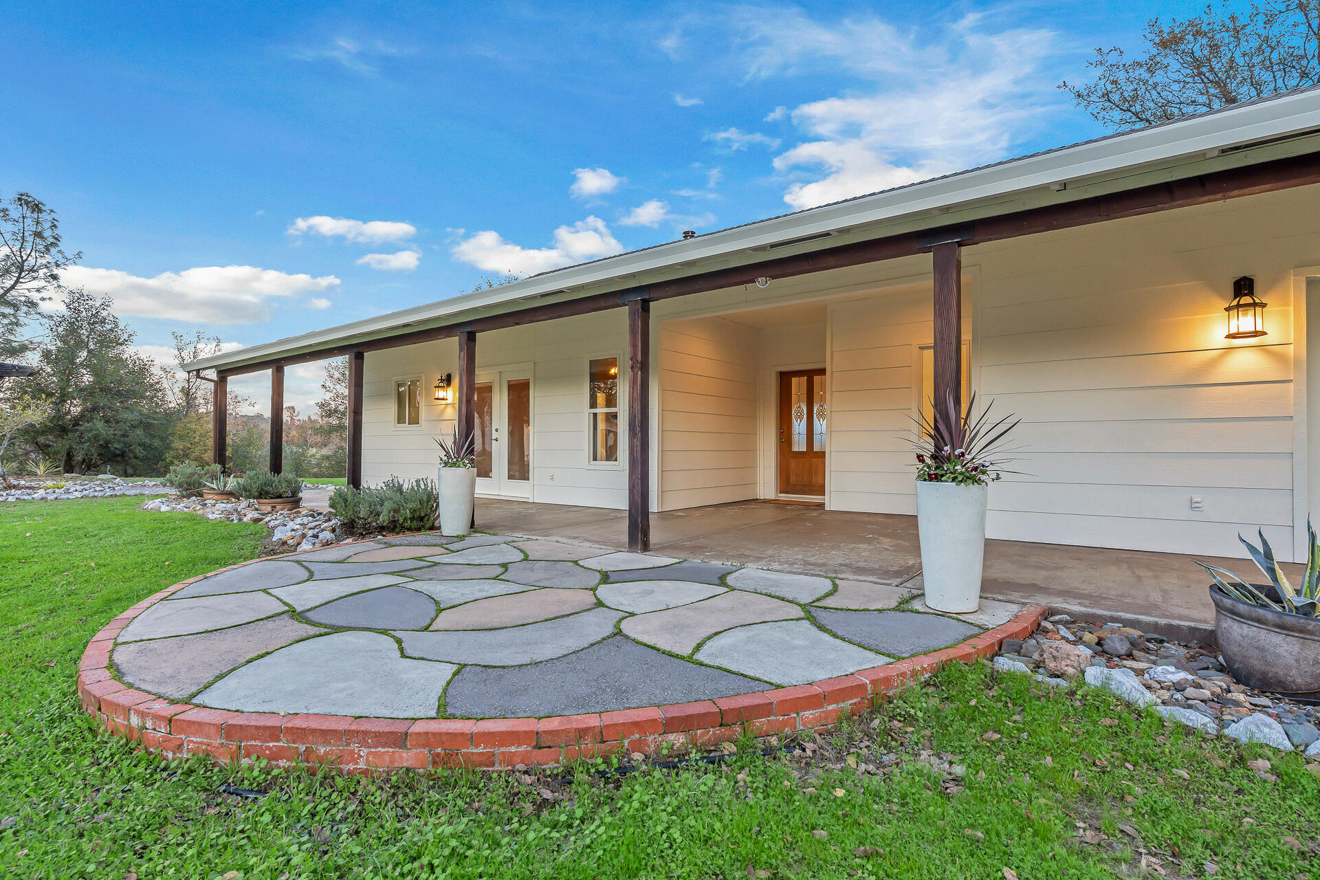 13303 Intermountain Road Redding, CA 96003 - Photo 17 of 64 a view of a house with backyard and sitting area