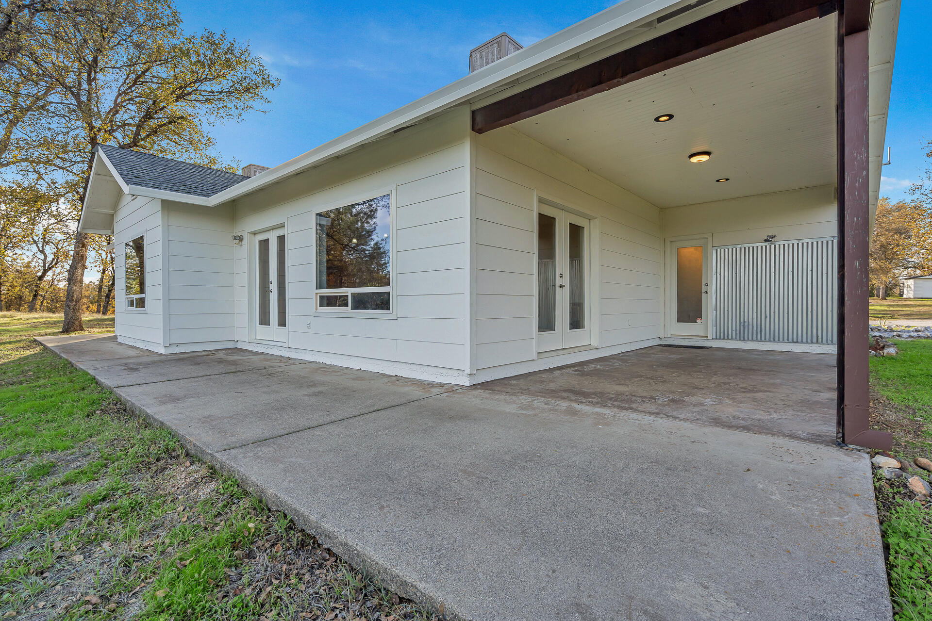 13303 Intermountain Road Redding, CA 96003 - Photo 20 of 64 a view of a house with a yard and garage