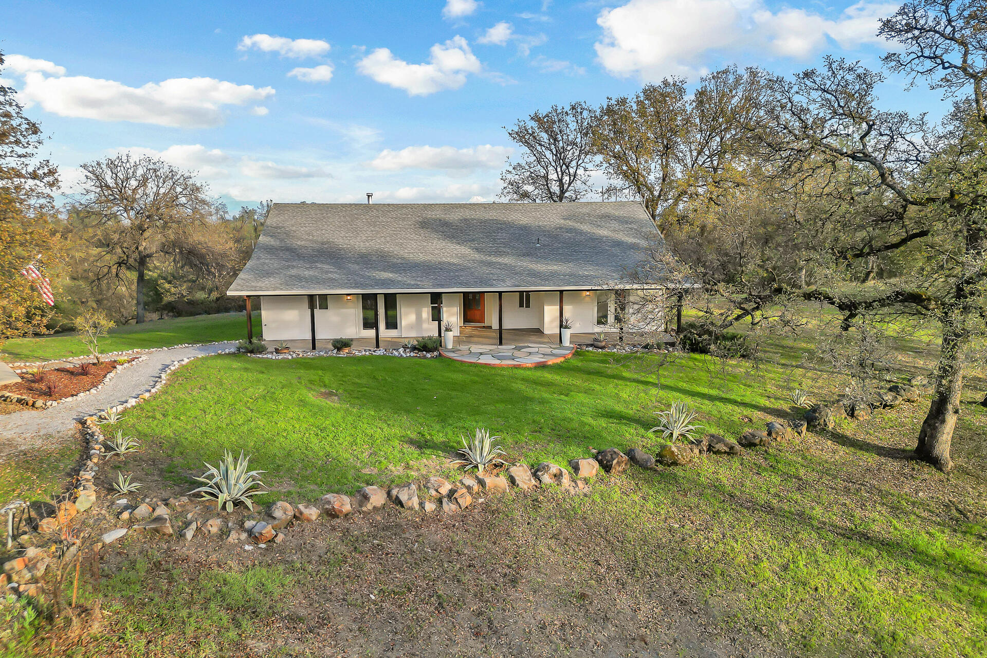13303 Intermountain Road Redding, CA 96003 - Photo 2 of 64 a view of a house with a big yard