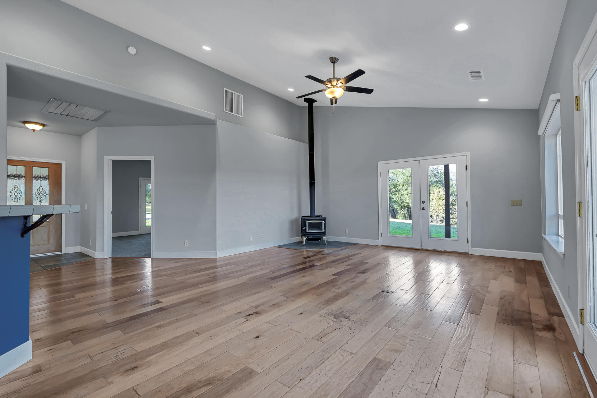 13303 Intermountain Road Redding, CA 96003 - Photo 31 of 64 a view of an empty room with wooden floor and a window