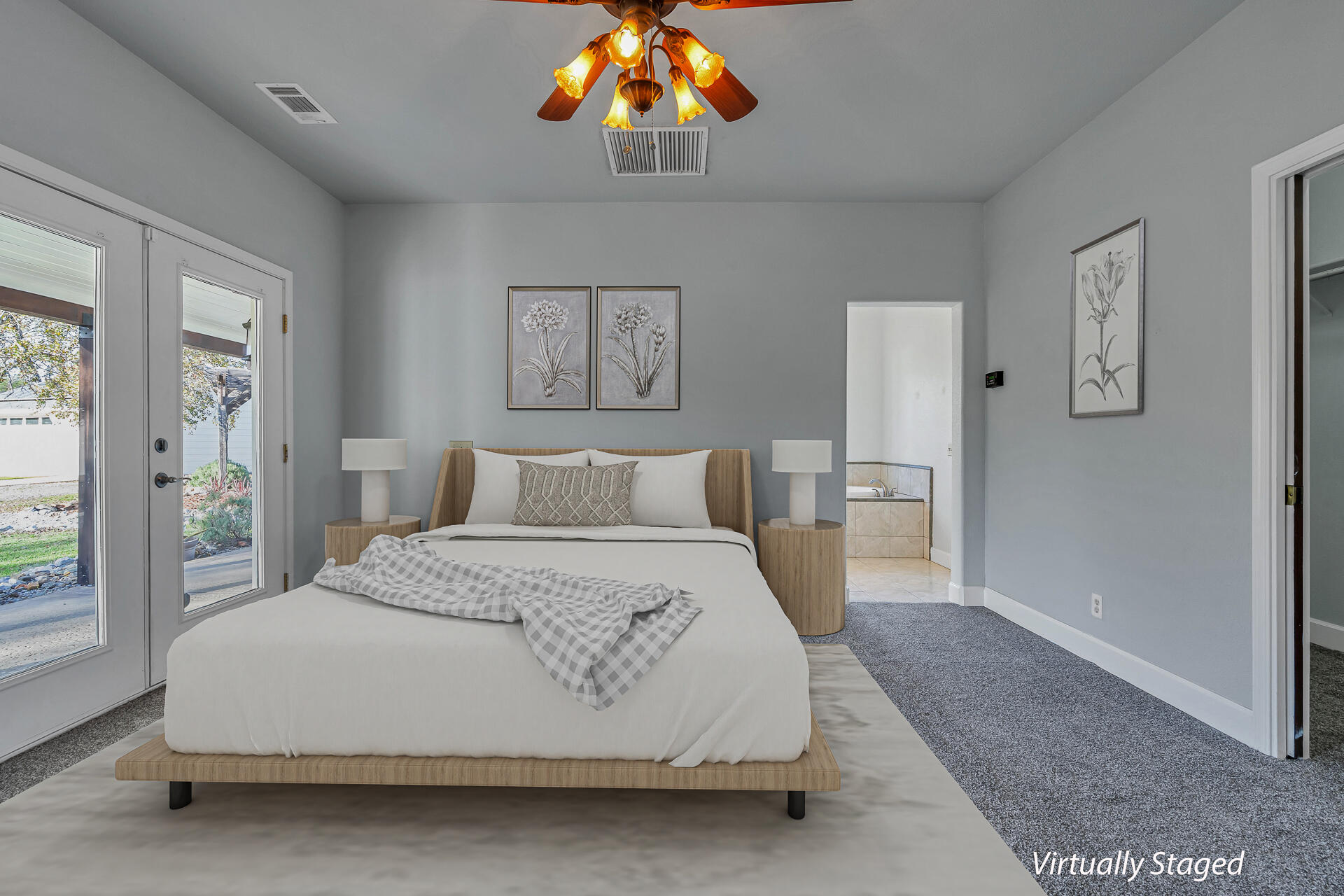 13303 Intermountain Road Redding, CA 96003 - Photo 43 of 64 a spacious bedroom with a bed and a chandelier