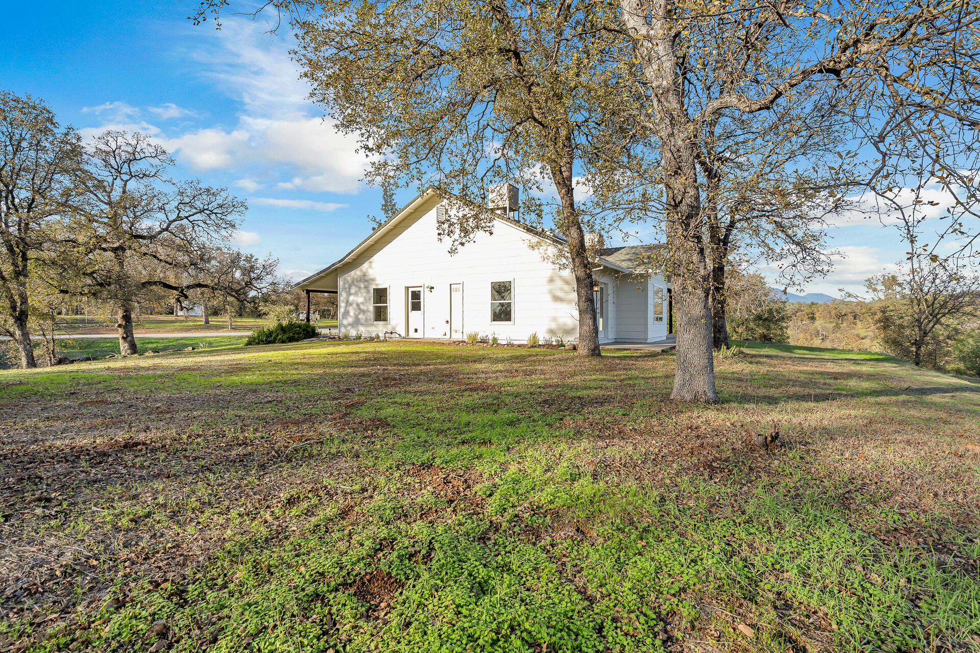 13303 Intermountain Road Redding, CA 96003 - Photo 63 of 64 a front view of a house with a yard