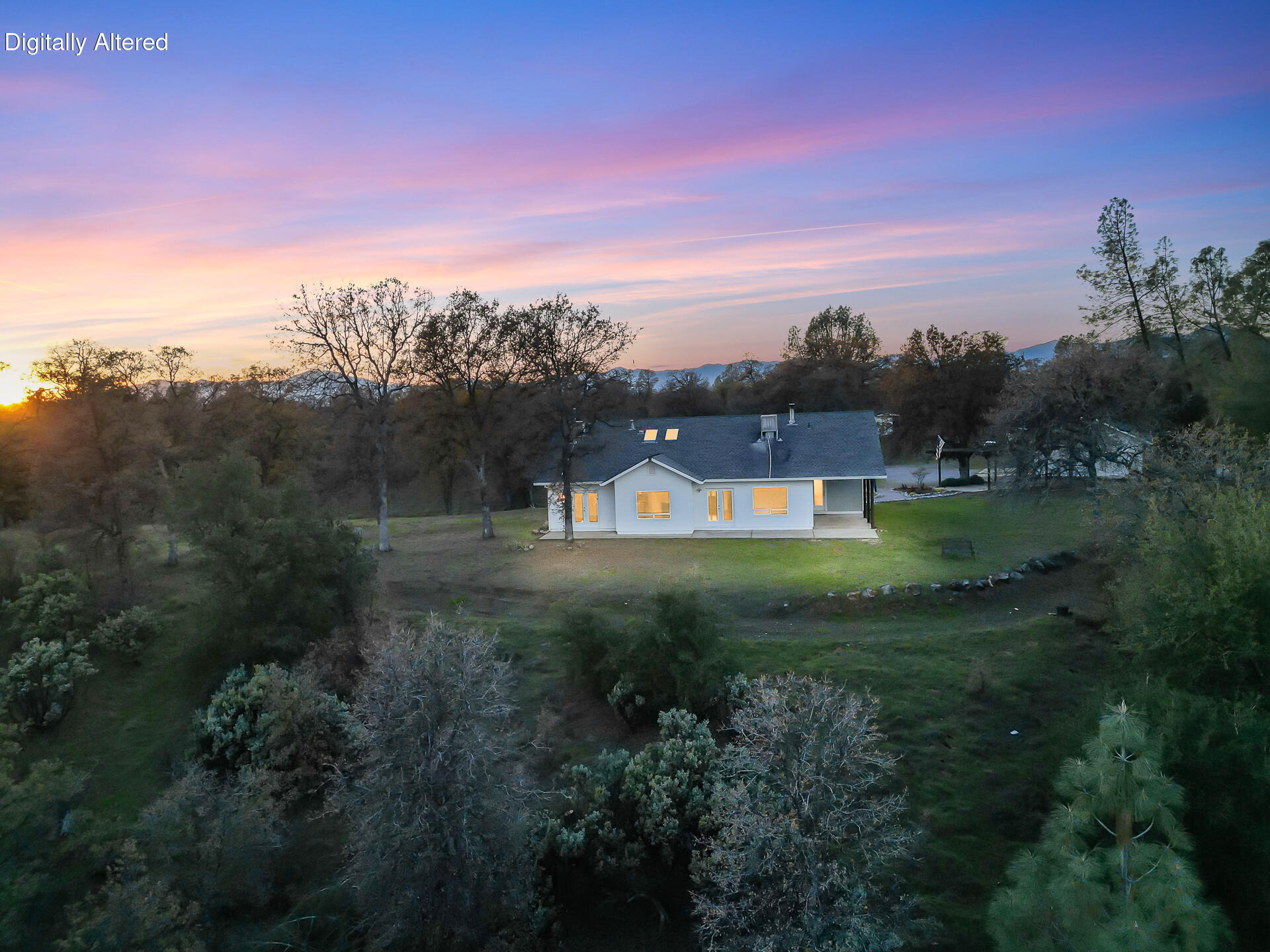 13303 Intermountain Road Redding, CA 96003 - Photo 7 of 64 a view of a big house with a big yard