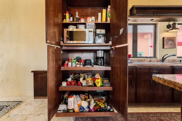 a view of walk in closet with clothes