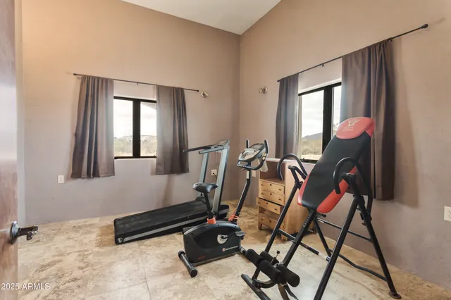 a bench sitting in a room next to a window