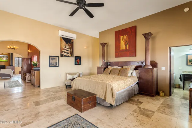 a bedroom with a bed and dresser