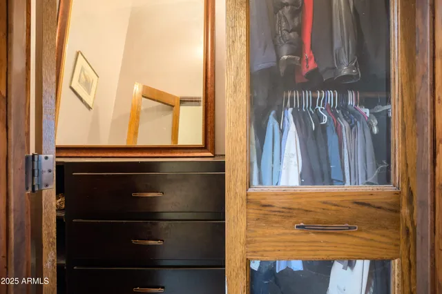 a living room with furniture large window and a flat screen tv