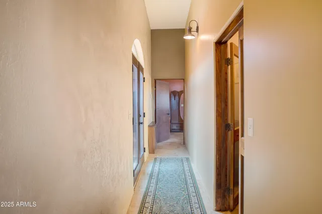 a living room with furniture and large windows