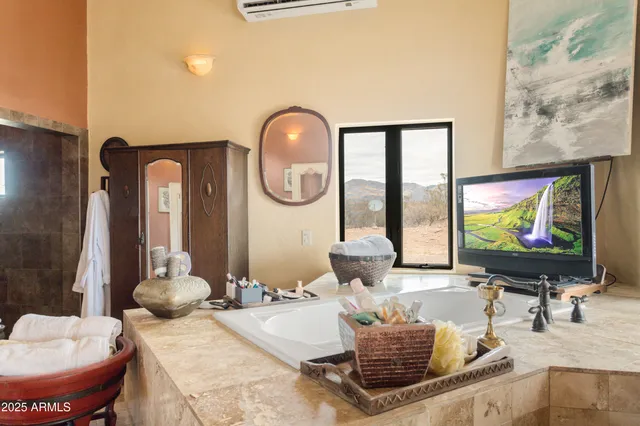 a kitchen with a sink a stove and a stove with wooden floor