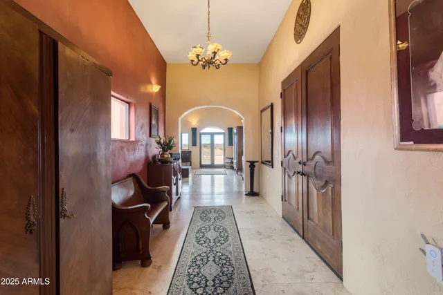 a dining room with furniture and a window