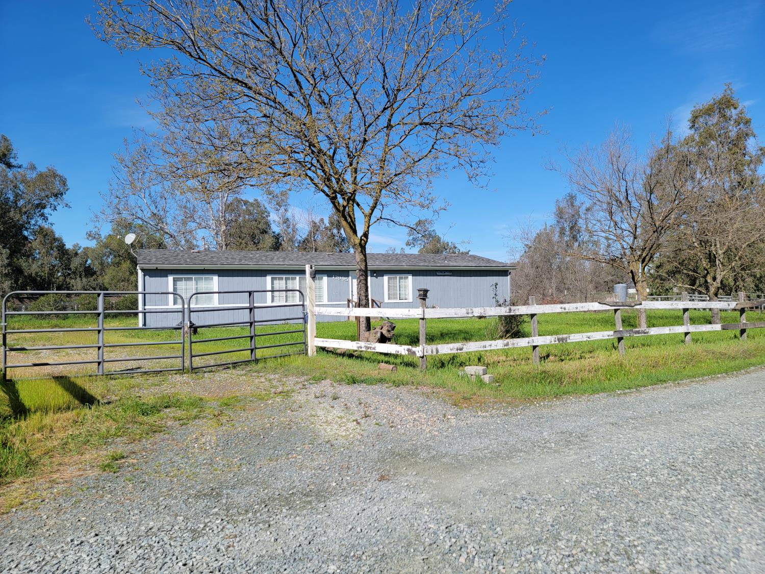 a view of a house with pool and a big yard