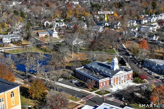 an aerial view of multiple houses with yard