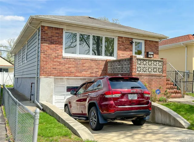 a car parked in front of a house