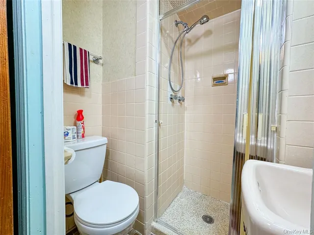 a bathroom with a tub and shower