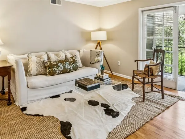 a living room with furniture and a lamp