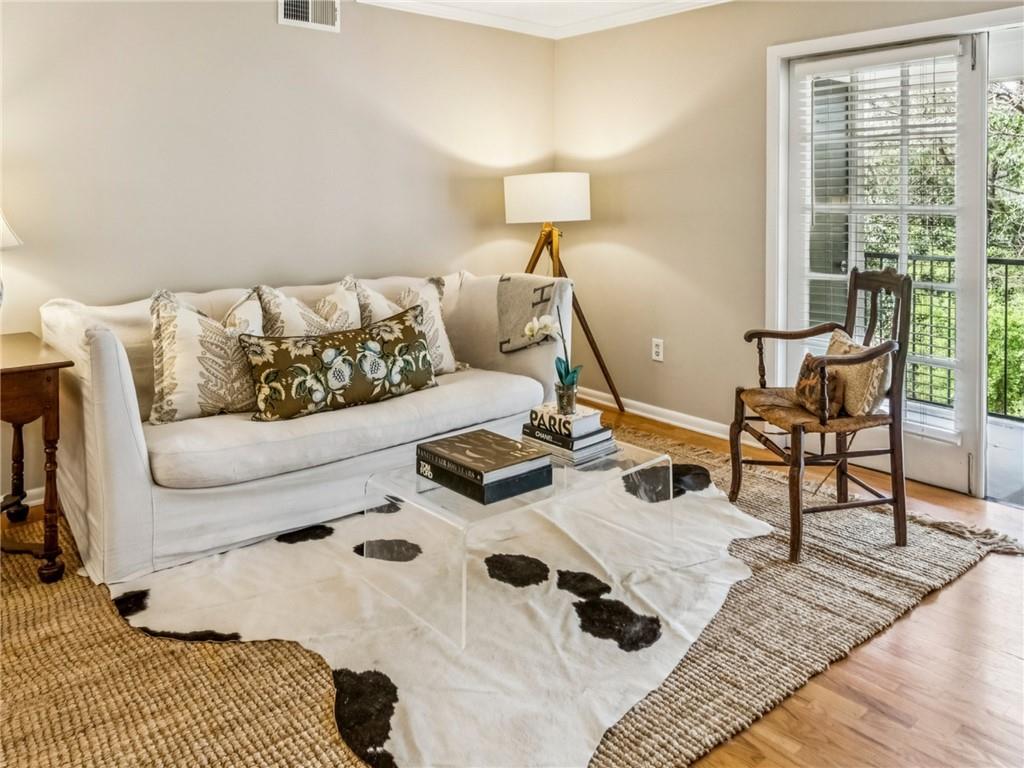 a living room with furniture and a lamp