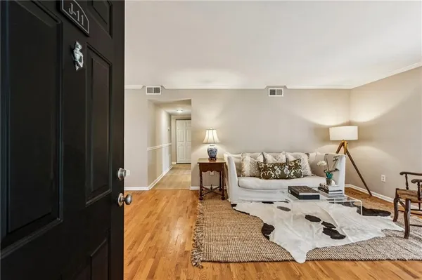 a bed room with a bed and a night stand