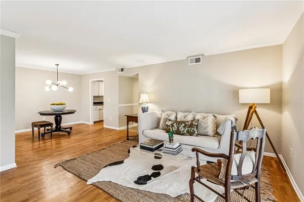 a living room with furniture and a table