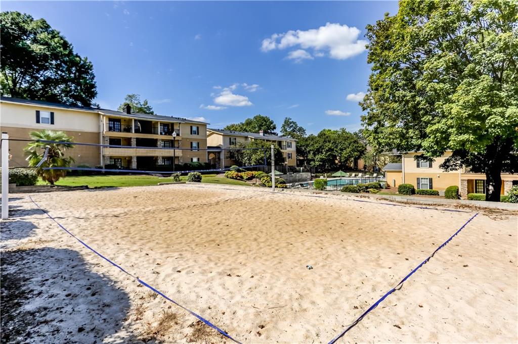1150 Collier Road Northwest, Unit J11 Atlanta, GA 30318 - Photo 21 of 25 a view of street with houses