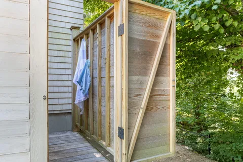 a view of a pathway along with potted plants