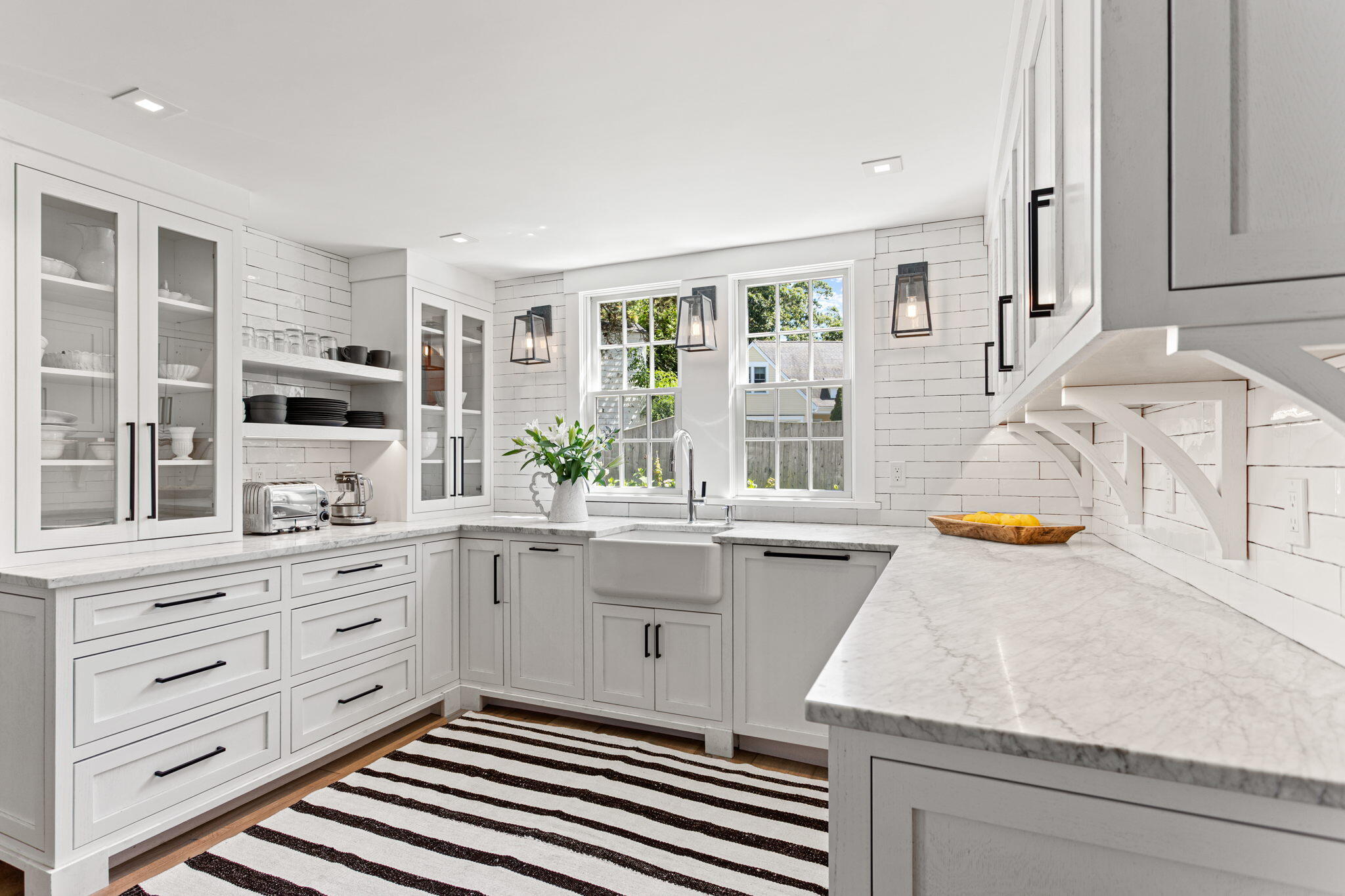 149 Old Stage Road Centerville, MA 02632 - Photo 21 of 69 a kitchen with stainless steel appliances granite countertop a stove a sink and a granite counter tops with white cabinets